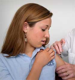 Young woman receiving vaccination